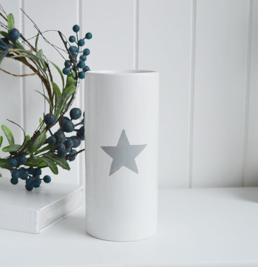 White ceramic vase with grey painted star.